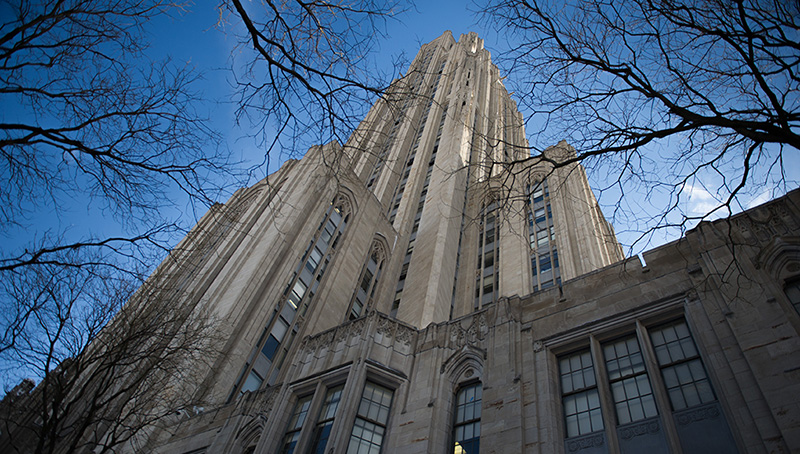 Exterior Of Cathedral Of Learning With Bare Trees In The Foreground - Winter.