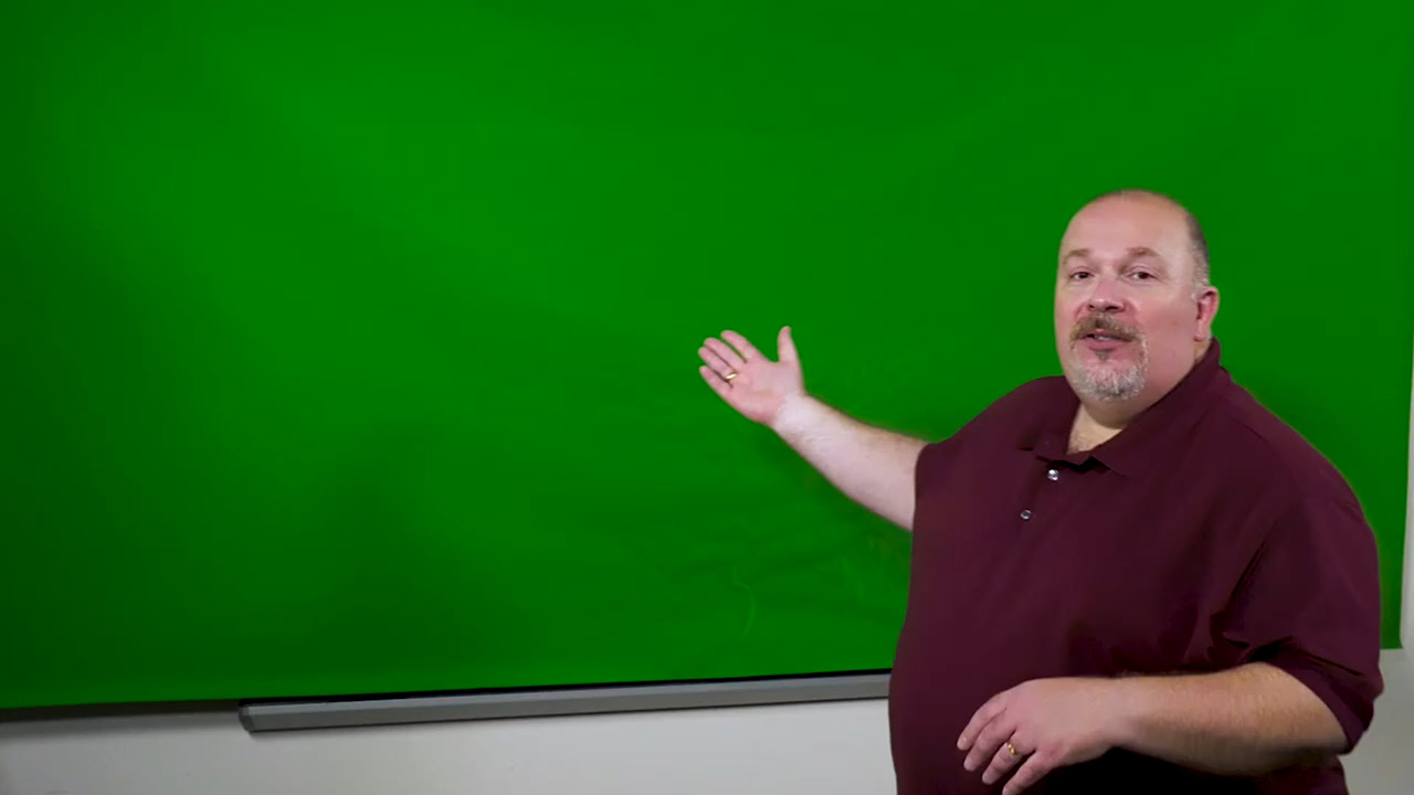 Media Creation Lab with faculty member using a green screen for lecture capture.