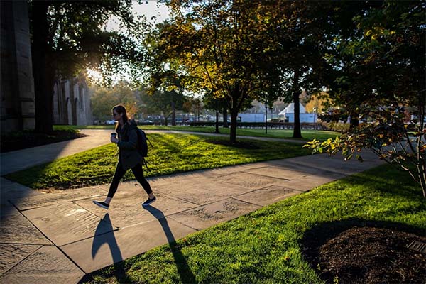 Student Walking On Campus Near Cathedral Of Learning