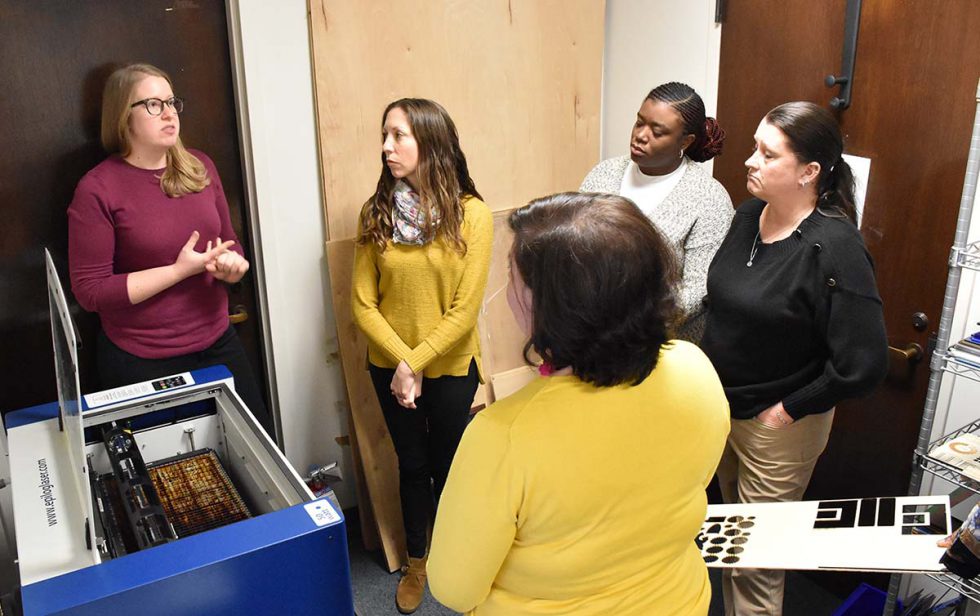 Sera Thornton Describes To Workshop Attendees How The Open Lab Laser Cutting And Engraving Machine Works.